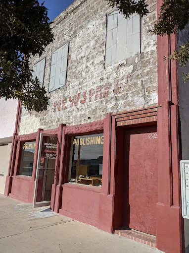 The front of The Standard's office on Beale Street, showing the PRINTING and PUBLISHING windows