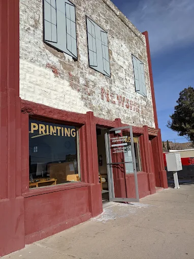 The Beale Street storefront showing the PRINTING window and red-painted brick